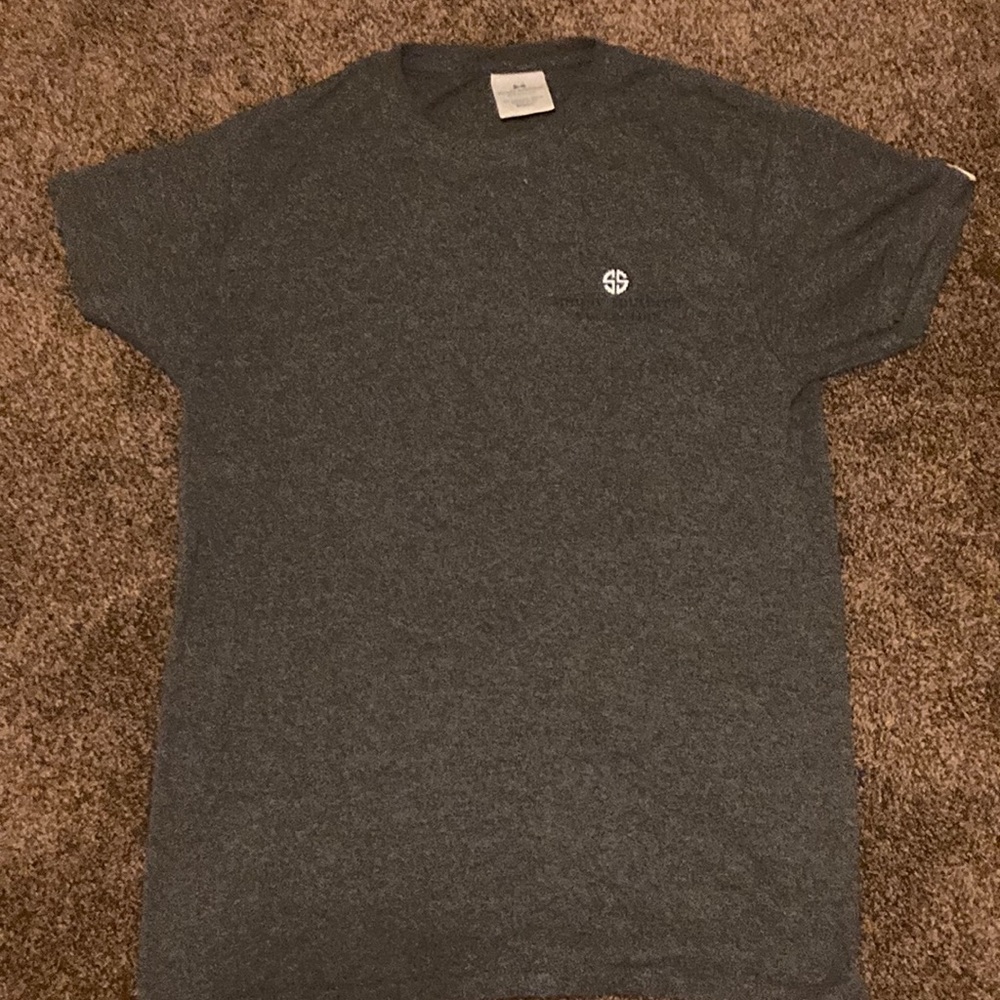 This is a grey T-shirt with sunflowers on the back.